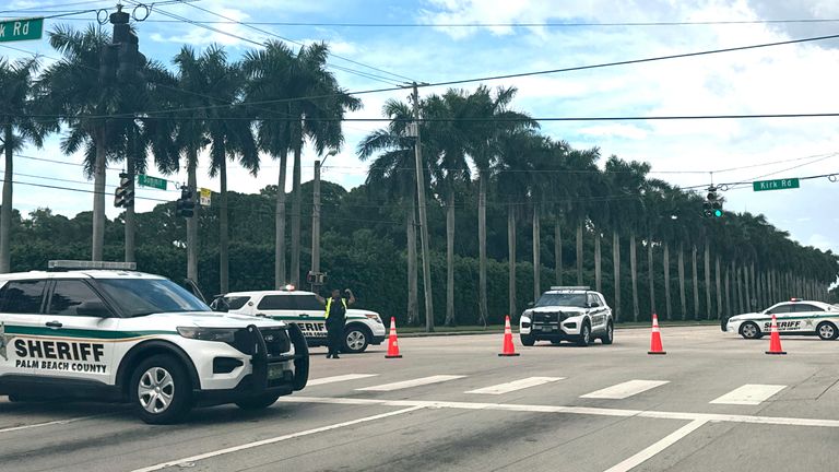 Police vehicles are seen near the Trump International Golf Club after gunshots were reported near Republican presidential candidate and former President Donald Trump. Image: AP