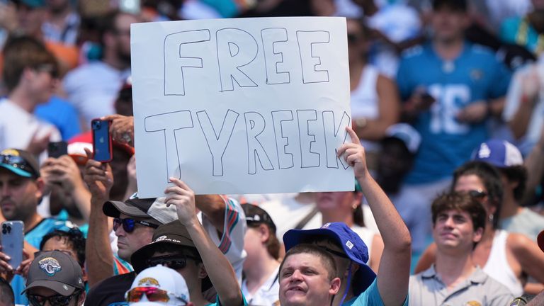 Miami Dolphins fans show support for wide receiver Tyreek Hill during the first half of an NFL football game against the Jacksonville Jaguars, Sunday, Sept. 8, 2024, in Miami Gardens, Fla. Hill was involved in a traffic altercation with Miami Dade police before the start of the game. (AP Photo/Wilfredo Lee)