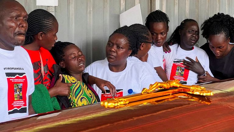 Family members mourn and react next to the coffin of the slain Olympian Rebecca Cheptegei, who died after her former boyfriend doused her in petrol and set her ablaze, at the Moi Teaching & Referral Hospital (MTRH) funeral home, in Eldoret, Kenya September 13, 2024. REUTERS/Edwin Waita