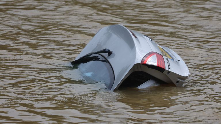 The rear boot of a submerged car is seen on the A421 dual carriageway road after it was flooded following heavy rain, at Marston Moretaine near Bedford, Britain, September 23, 2024. REUTERS/Toby Melville