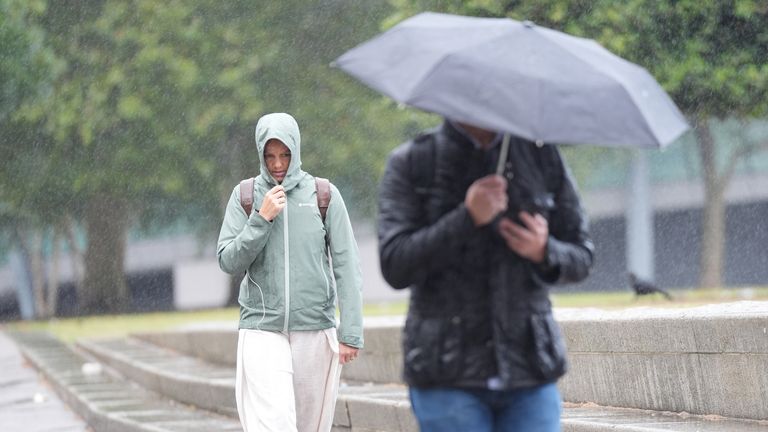 Britons caught in Storm Lilian last month during what was the coolest summer in years. Pic: PA