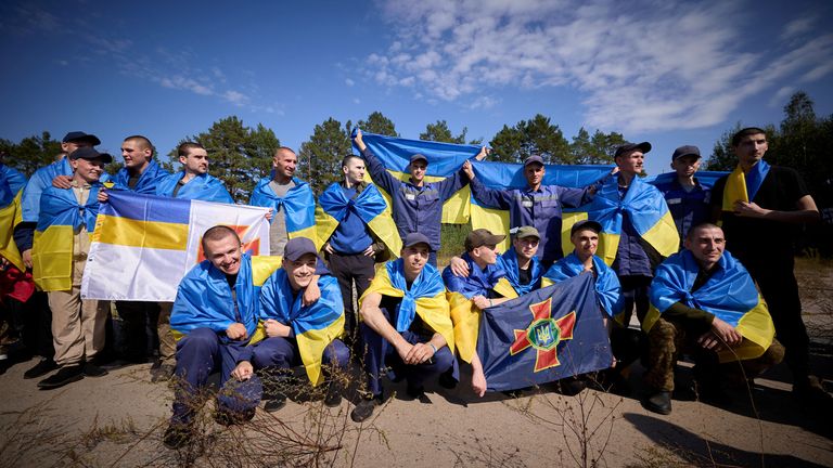 Ukrainian prisoners of war (POWs) pose for a picture after an exchange with Russia, at an unknown location in Ukraine. Pic: Ukrainian Presidential Press Service via Reuters