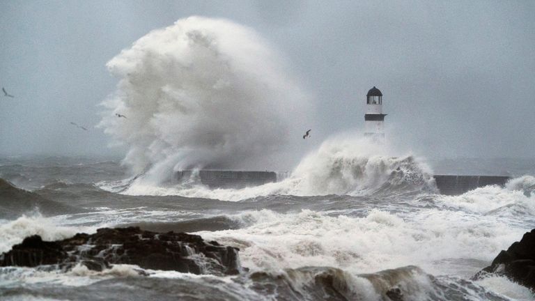 Waves crash against the lighthouse in Seaham Harbour, County Durham. Pic: Owen Humphreys/PA 