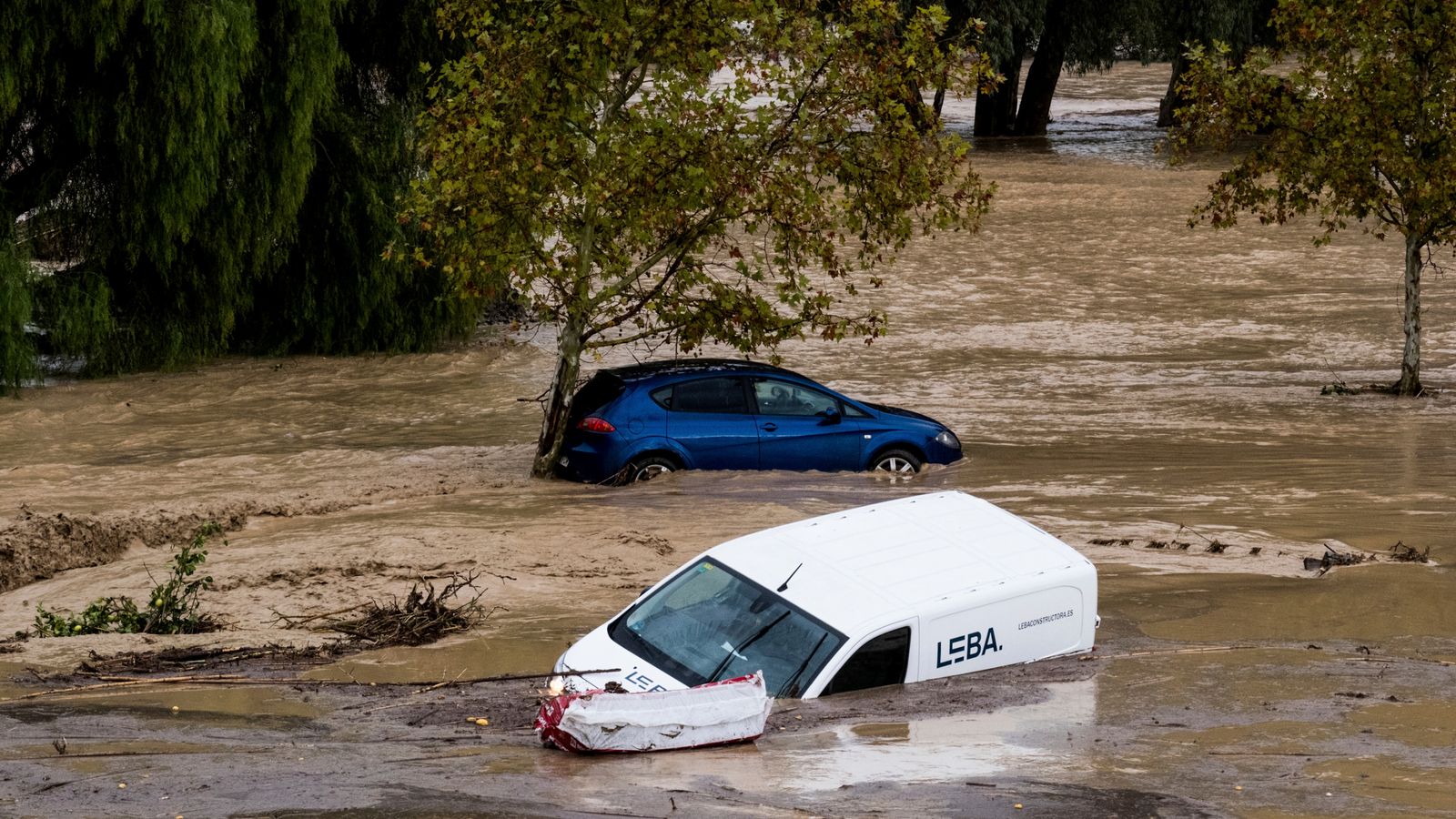 Several bodies found as flash floods sweep cars through streets in Spain