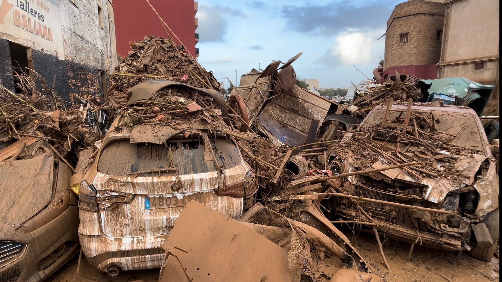 Spain floods: Epicentre now a bizarre medley of debris - as video shows miraculous rescue