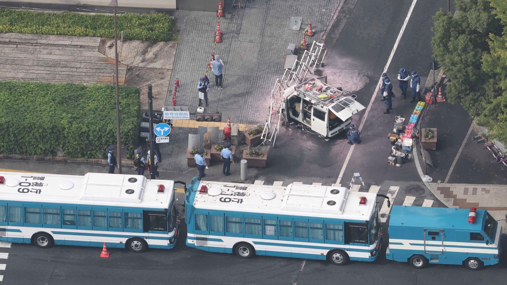 Firebombs thrown at Japan’s ruling party HQ and car rammed into security fence around PM’s office