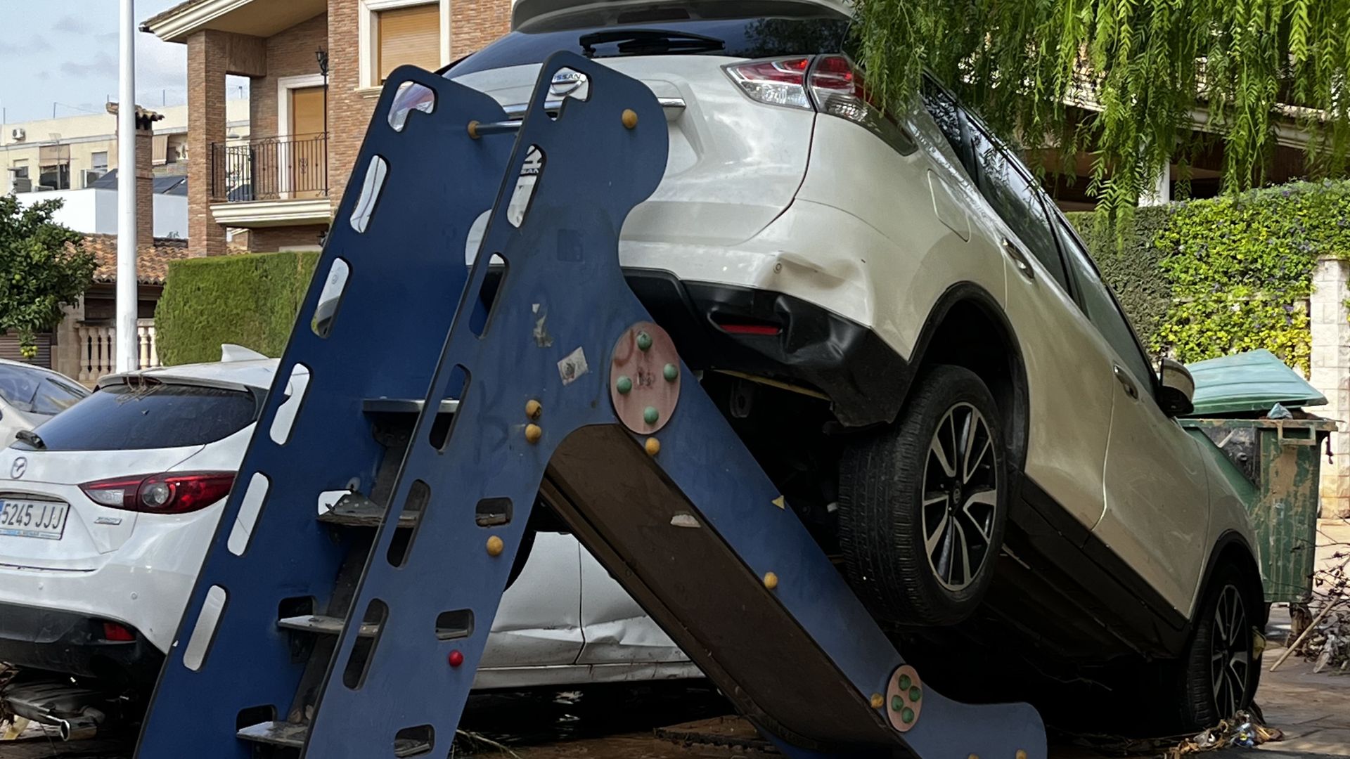Utterly random damage in Spanish town where 40 died, with a car on top of children's slide