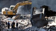 People inspect the damage at the site of an Israeli strike, amid ongoing hostilities between Hezbollah and Israeli forces, in Beirut, Lebanon October 11, 2024. REUTERS/Mohamed Azakir
