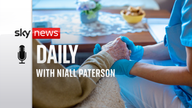 Nurse holds the hand of an elderly person. 