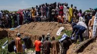People prepare bodies for burial following a fuel tanker explosion in Majiya town, Nigeria, Wednesday, Oct.16, 2024. (AP Photo/Sani Maikatanga)