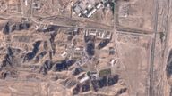 This satellite photo from Planet Labs PBC shows damaged buildings at Iran's Parchin military base outside of Tehran, Iran, Sunday, Oct. 27, 2024. An Israeli attack on Iran damaged facilities at a secretive military base southeast of the Iranian capital that experts in the past have linked to Tehran's onetime nuclear weapons program and at another base tied to its ballistic missile program, satellite photos analyzed Sunday by The Associated Press show. The damaged structures are in the bottom right corner and bottom center of the image. (Planet Labs PBC via AP)