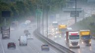 Motorists drive along the A14 near Kettering in Northamptonshire as a yellow warning for thunderstorms is in place. PA