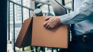 An employee leave their job for the last time with a box of possessions. Pic: iStock