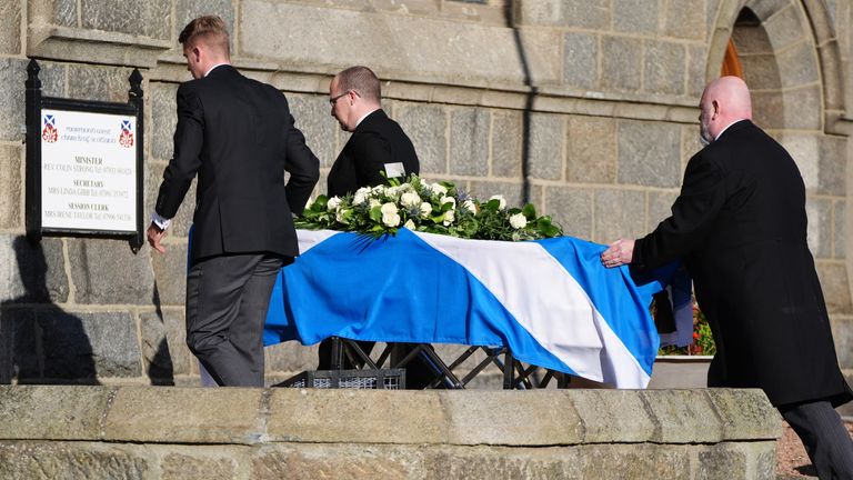 Pall bearers with the coffin, draped in a Saltire flag, arriving for the funeral service for former first minister of Scotland Alex Salmond, at Strichen Parish Church in Strichen, Fraserburgh. The former Alba Party and SNP leader died of a heart attack while attending a conference in North Macedonia earlier this month. Picture date: Tuesday October 29, 2024.