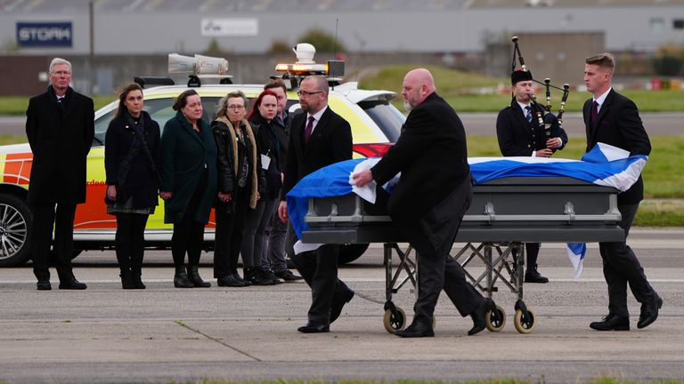 Alex Salmond's body is repatriated to the UK, watched by members of his family and acting Alba Party leader Kenny MacAskill. Pic: PA