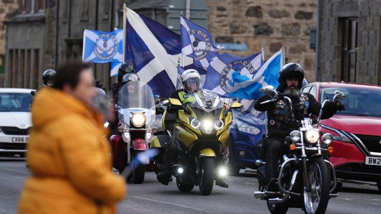 Yes Bikers in Fraserburgh as the funeral cortage of Scotland Alex Salmond arrives at Fraserburgh Funeral Services, after his repatriation to the UK following his death on Saturday afternoon at the Institute for Cultural Diplomacy Forum in the North Macedonia lake-resort town of Ohrid. Picture date: Friday October 18, 2024.