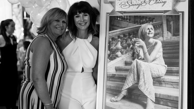 Angela MacVicar and Lindsay MacCallum alongside a picture of Ms MacVicar's late daughter, Johanna. Pic: Rainbow Valley