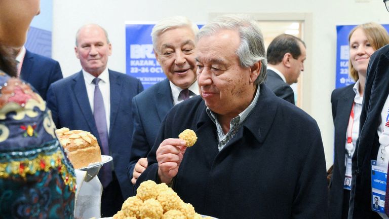 Guterres eating some chak-chak at the BRICS summit in Kazan. Pic: Reuters