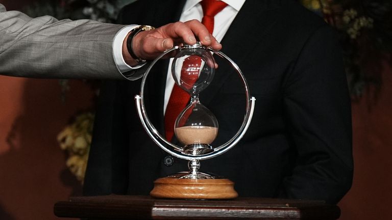 President of the Legislative Council, Ben Franklin (right), watches as King Charles III turns an hourglass he is presenting as a gift to mark the Bicentenary of the New South Wales Legislative Council, during an event marking the anniversary at New South Wales Parliament House, in Sydney, on day one of his visit to Australia and Samoa. The specially commissioned hourglass was handmade at The Goldsmith’s Centre, with the wooden base supplied by The King’s Foundation from a cedar tree at his Highg