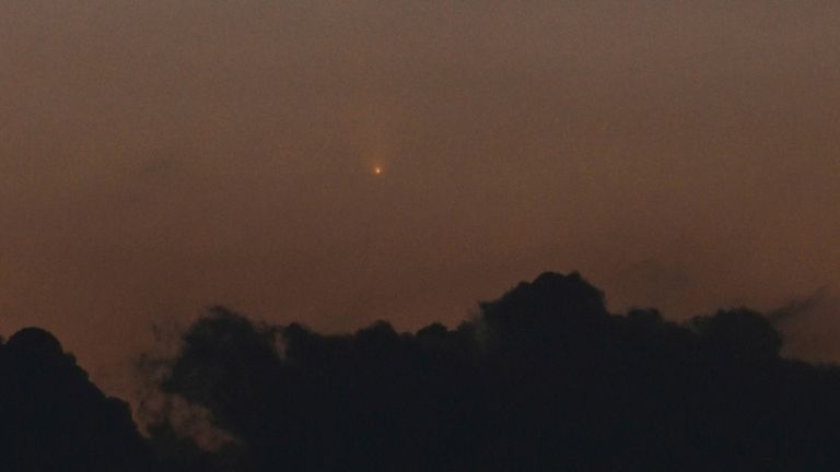 C/2023 A3 (Tsuchinshan-ATLAS) and its comet tail are observed in the western sky from Kamakura City, Kanagawa Prefecture, Japan, after sunset on October 12, 2024. ( The Yomiuri Shimbun via AP Images )