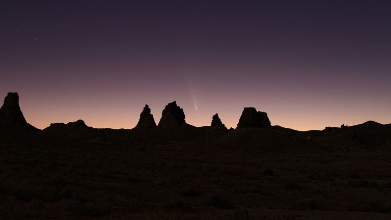 Comet Tsuchinshan-ATLAS, C/2023, with an 80,000 year orbit, passes behind geological formations, tufa spires at Trona Pinnacles, California, U.S. October 12, 2024.  REUTERS/David Swanson