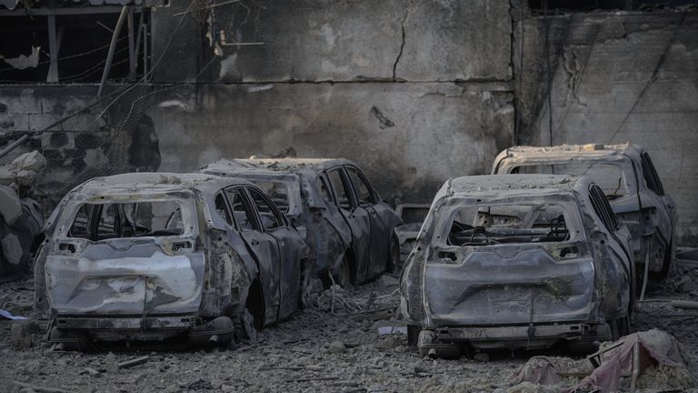 Charred cars at the site of an Israeli airstrike in Dahieh, Beirut, Lebanon, Sunday, Oct. 6, 2024. (AP Photo/Bilal Hussein)


