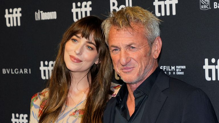 Cast members Dakota Johnson and Sean Penn attend the international premiere of 