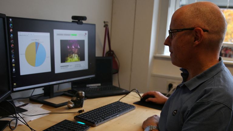 University of Copenhagen post-doctoral researcher Jeppe Have Rasmussen shows how spectrograms of pig calls are analysed on a computer in Copenhagen, Denmark, October 22. REUTERS/ Tom Little
