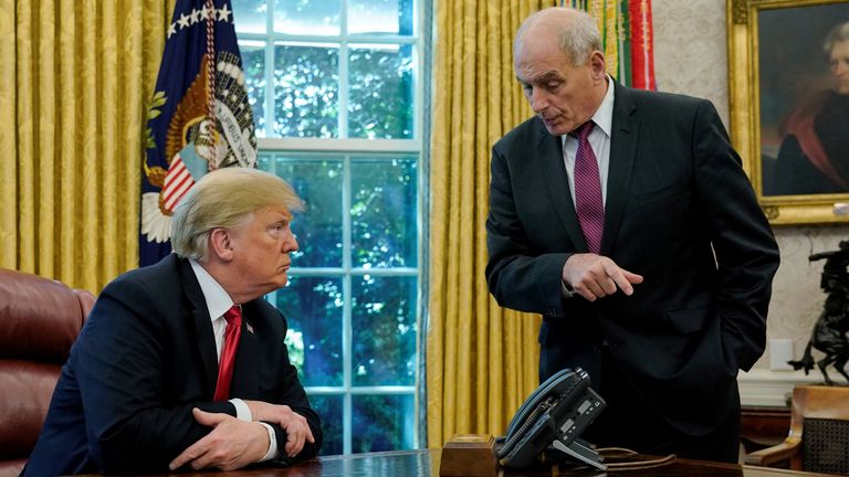 U.S. President Donald Trump speaks to White House Chief of Staff John Kelly after an event with reporters in the Oval Office at the White House in Washington, U.S. October 10, 2018. REUTERS/Jonathan Ernst TPX IMAGES OF THE DAY