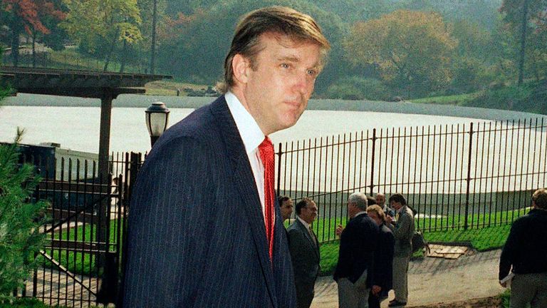 FILE - In this Oct. 23, 1986 file photo, Donald Trump is photographed in New York's Central Park in front of the Wollman Rink, which he proposed rebuilding after the city's renovation efforts were halted. New York intends to terminate contracts with Trump to manage two ice rinks and other facilities in Central Park after a Trump-inspired mob breached the U.S. Capitol, Mayor Bill de Blasio announced on Tuesday, January 12, 2021. (AP Photo/Mario Suriani , file)