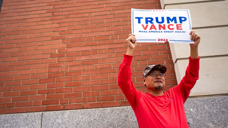 A Trump supporter outside the vice presidential debate in October. Pic: AP