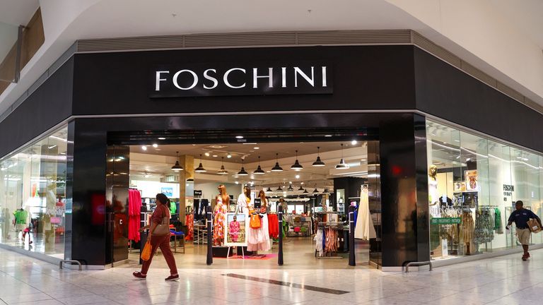 A shopper walks past a Foschini store at a shopping centre in Johannesburg, South Africa, November 11, 2022. REUTERS/Siphiwe Sibeko
