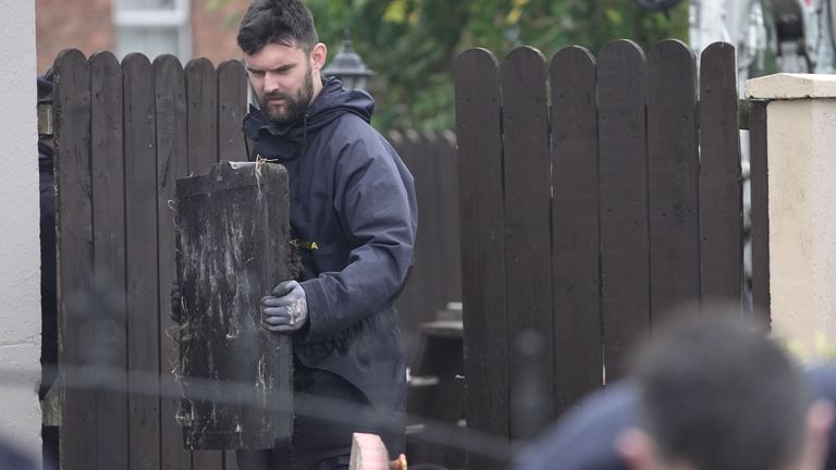 Gardai continue a search of waste ground behind a house in Dundalk, Co Louth.
Pic:PA