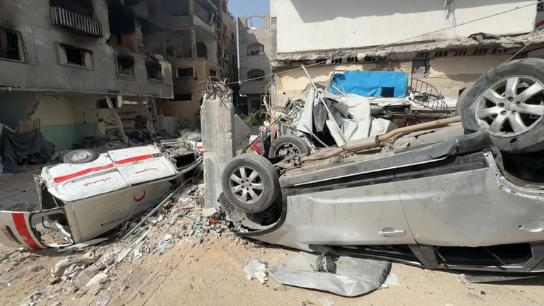 Ruined vehicles lie in the devastated streets around the hospital 