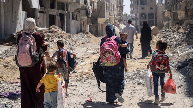 Palestinian women and their children walk though Jabalia in northern Gaza. File pic: AP Photo/Enas Rami