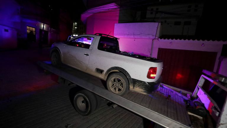 A pickup truck is transported from the site where Alejandro Arcos, the mayor of Chilpancingo, was murdered, in Chilpancingo, Guerrero state, Mexico on October 6, 2024. REUTERS/Oscar Guerrero