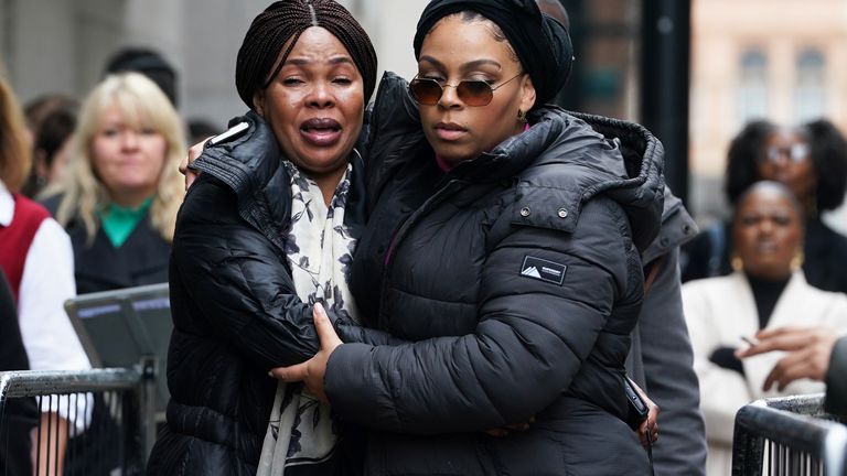 Helen Lumuanganu (left), the mother of Chris Kaba, arriving at the Old Bailey.
Pic: PA