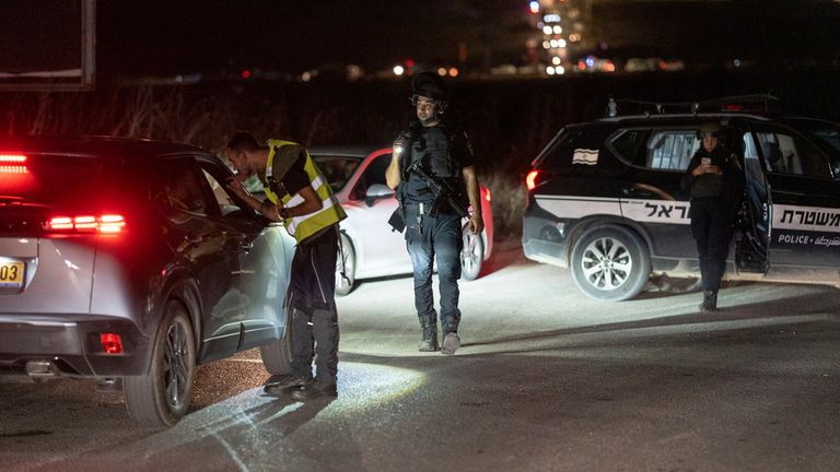 Emergency services and police block the road to the scene of a drone strike by Hezbollah. Pic: AP