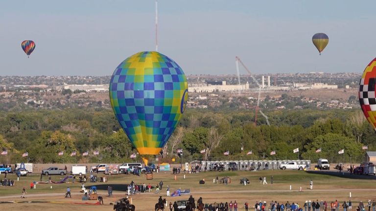 This image made from a video provided by Curt Fargo shows a radio tower collapsing after a hot-air balloon struck it during the famous festival in Albuquerque, N.M., Oct. 11, 2024. (Curt Fargo via AP)