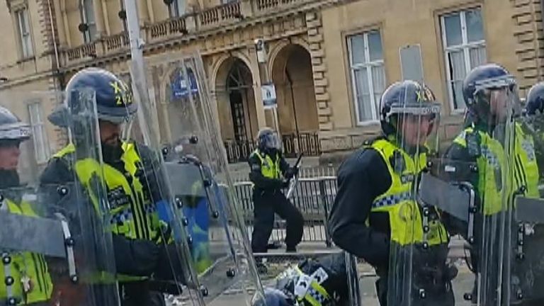 Police outside a hotel housing asylum seekers in Hull during the riots