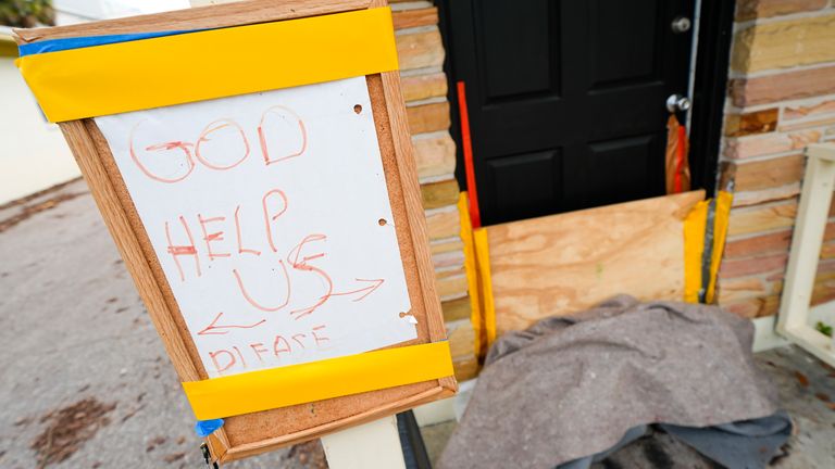 A message is seen outside an apartment in the Davis Islands community of Tampa, Florida. Photo: AP