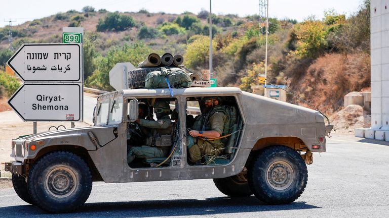 Israeli soldiers in a military vehicle in northern Israel. Pic: Reuters