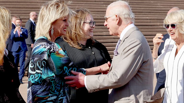 Dame Joanna Lumley greets King Charles III and Queen Camilla on the forecourt of Sydney Opera House, as they arrive to mark its 50th anniversary, on day three of the royal visit to Australia and Samoa. Picture date: Tuesday October 22, 2024. PA Photo. See PA story ROYAL Tour. Photo credit should read: Chris Jackson/PA Wire