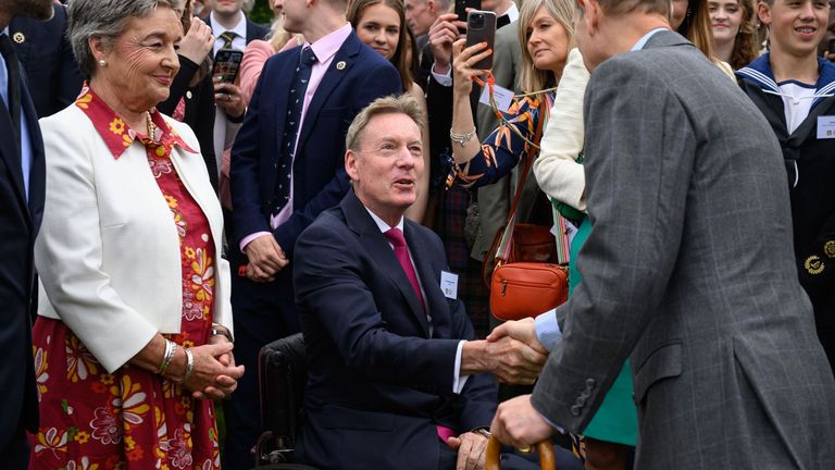 Journalist Frank Gardner shakes hands with Duke of Edinburgh during the Duke of Edinburgh's Gold Award celebrations, in the garden of Buckingham Palace, London. The event is attended by over 8,000 young people from across the country. Picture date: Monday May 13, 2024.

