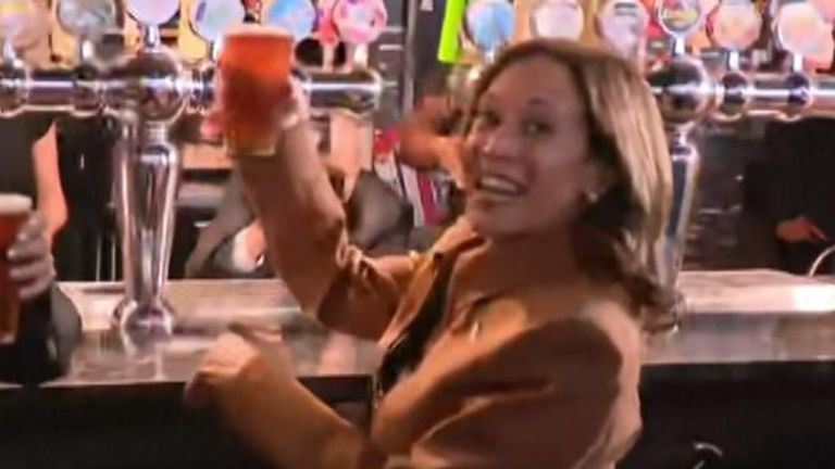 Kamala Harris drinks beer after a rally in Michigan