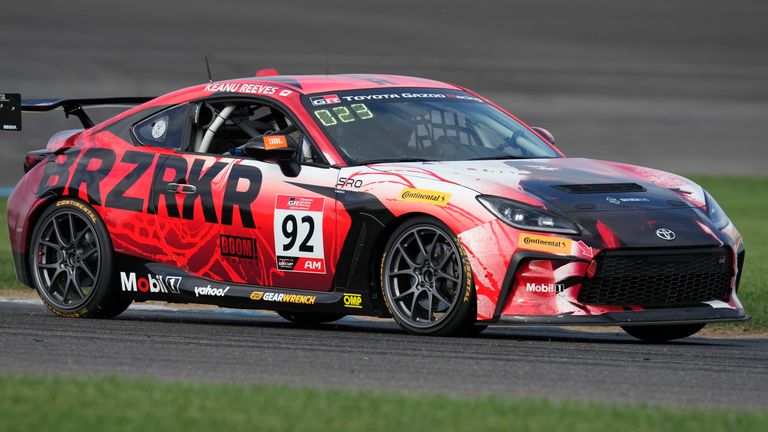 Keanu Reeves drives during the GR Cup Series auto race at Indianapolis Motor Speedway, Saturday, Oct. 5, 2024, in Indianapolis. (AP Photo/Darron Cummings)