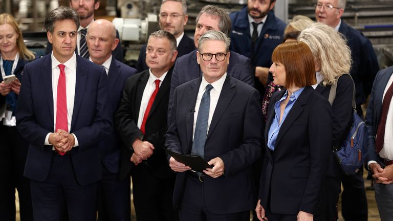 Keir Starmer arrives with Rachel Reeves and Ed Miliband.
Pic: PA