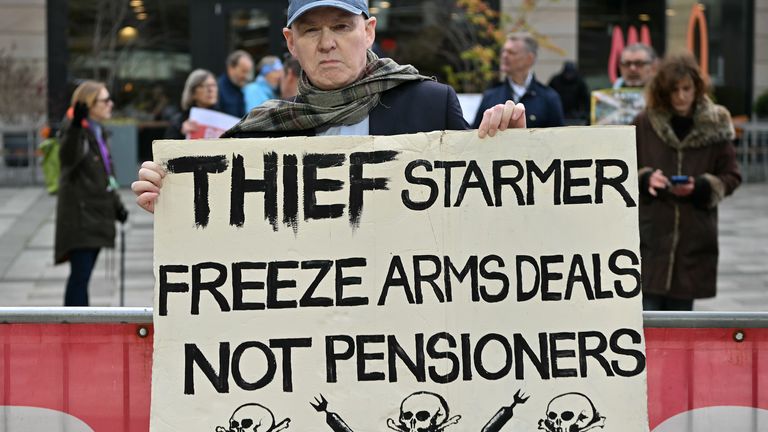 Demonstrators protest outside of Queen Elizabeth House in Edinburgh. Pic: PA