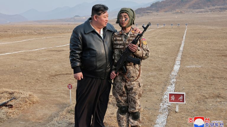 North Korean leader Kim Jong Un interacts with a soldier during the training of the Korean People's Army's air and amphibious combat units in this picture released on March 16, 2024, by the Korean Central News Agency. KCNA via REUTERS ATTENTION EDITORS - THIS IMAGE WAS PROVIDED BY A THIRD PARTY. REUTERS IS UNABLE TO INDEPENDENTLY VERIFY THIS IMAGE. NO THIRD PARTY SALES. SOUTH KOREA OUT. NO COMMERCIAL OR EDITORIAL SALES IN SOUTH KOREA.