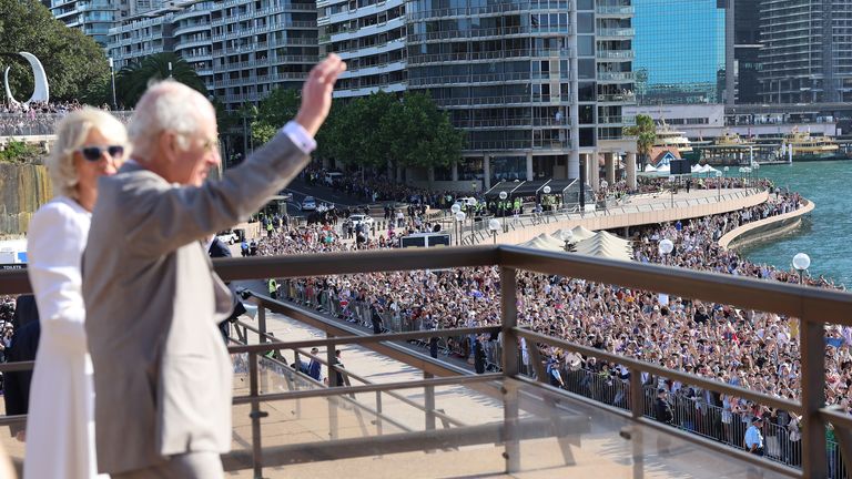 King Charles III and Queen Camilla waves to spectators from the Sydney Opera House, during a visit to to mark its 50th anniversary, on day three of the royal visit to Australia and Samoa. Picture date: Tuesday October 22, 2024.
